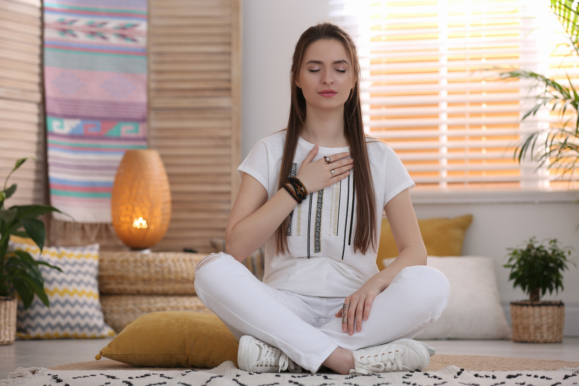 Young Woman during Self-Healing Session in  Room