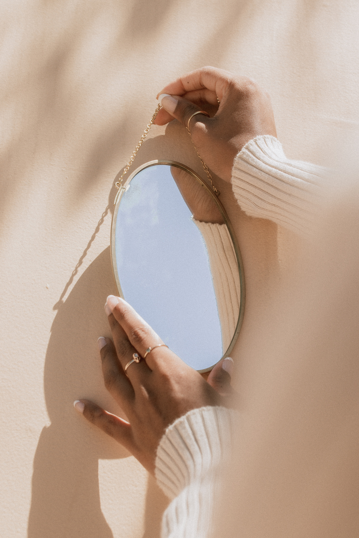 Female Hands Holding a Mirror